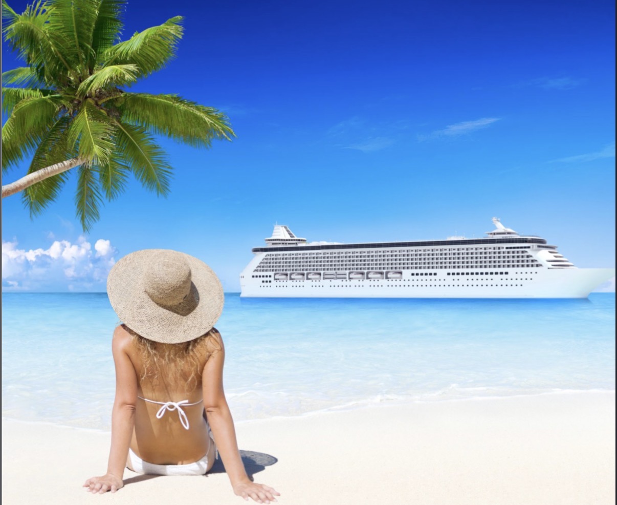 Cruise ship anchored off a tropical palm beach